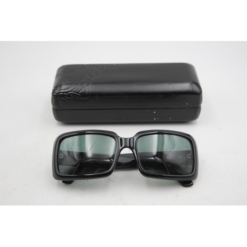 2433 - A pair of cased Versace black oversized sunglasses