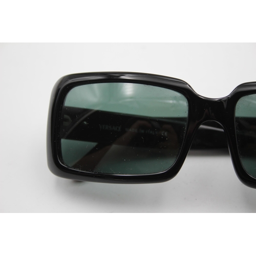 2433 - A pair of cased Versace black oversized sunglasses