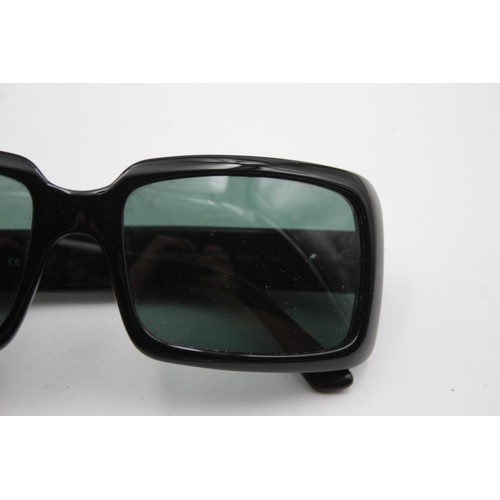 2433 - A pair of cased Versace black oversized sunglasses