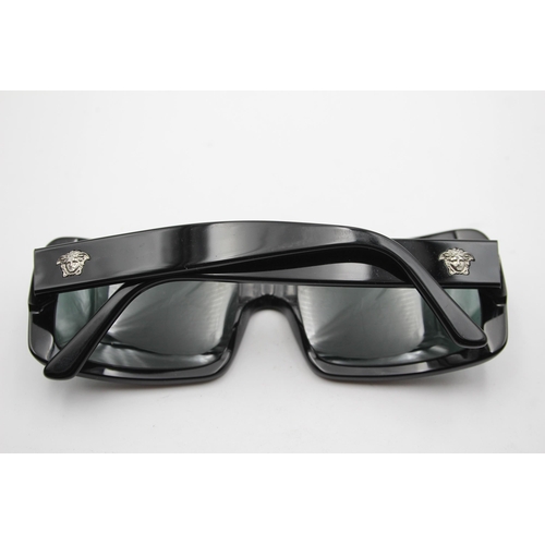 2433 - A pair of cased Versace black oversized sunglasses