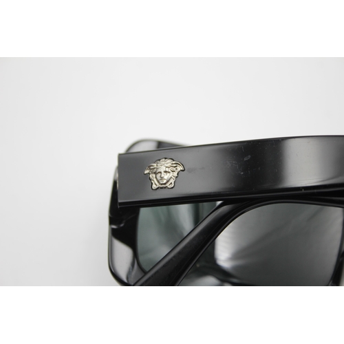 2433 - A pair of cased Versace black oversized sunglasses