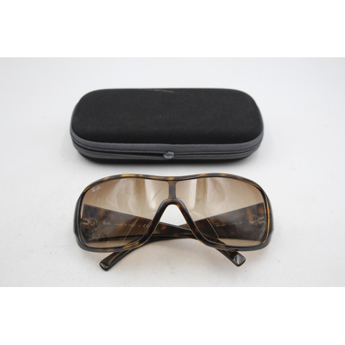 2436 - A pair of cased Ray-Ban visor style tortoiseshell effect sunglasses