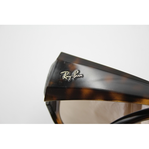 2436 - A pair of cased Ray-Ban visor style tortoiseshell effect sunglasses