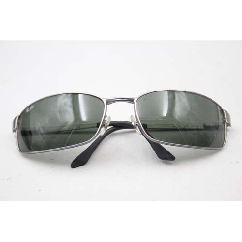 2438 - A pair of cased Ray-Ban grey sunglasses