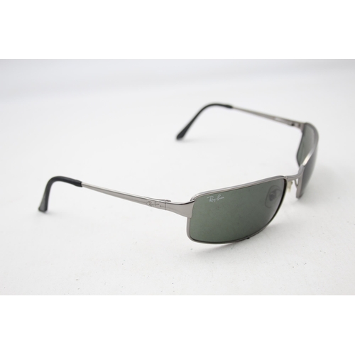 2438 - A pair of cased Ray-Ban grey sunglasses