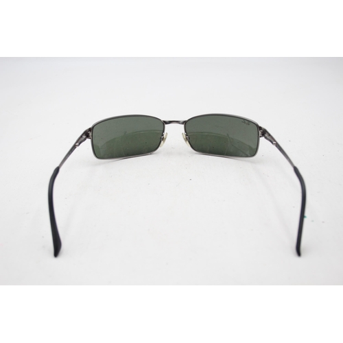 2438 - A pair of cased Ray-Ban grey sunglasses