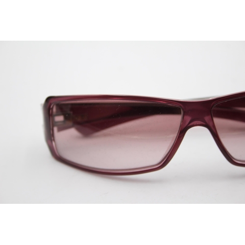 2439 - A pair of cased Gucci purple sunglasses