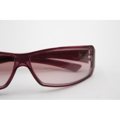 2439 - A pair of cased Gucci purple sunglasses