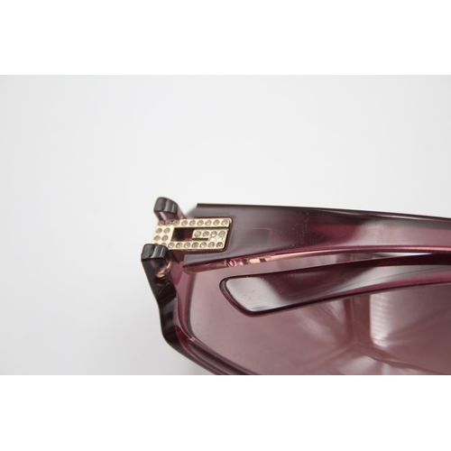 2439 - A pair of cased Gucci purple sunglasses