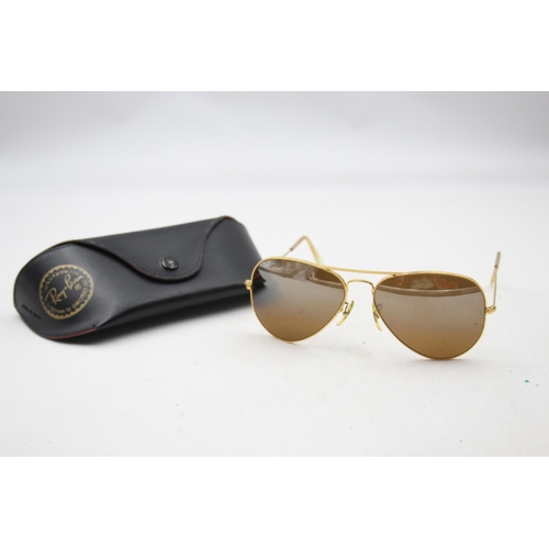 2440 - A pair of cased Bausch & Lomb Ray-Ban Aviator gold tone sunglasses