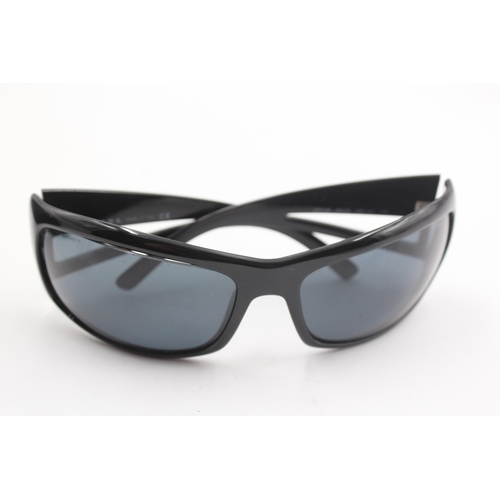 2441 - A pair of cased Prada black oversized sunglasses