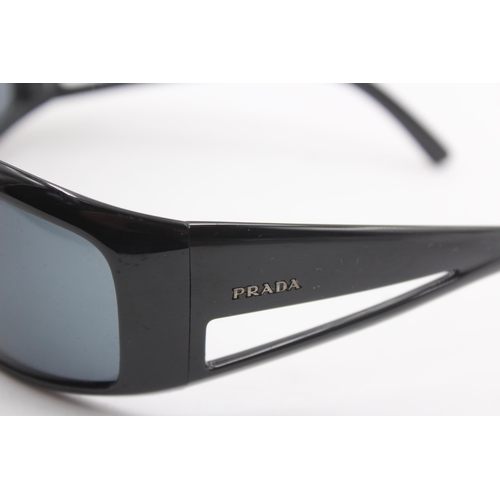 2441 - A pair of cased Prada black oversized sunglasses