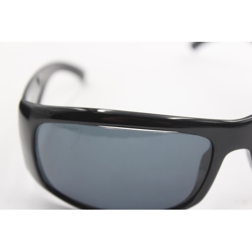 2441 - A pair of cased Prada black oversized sunglasses