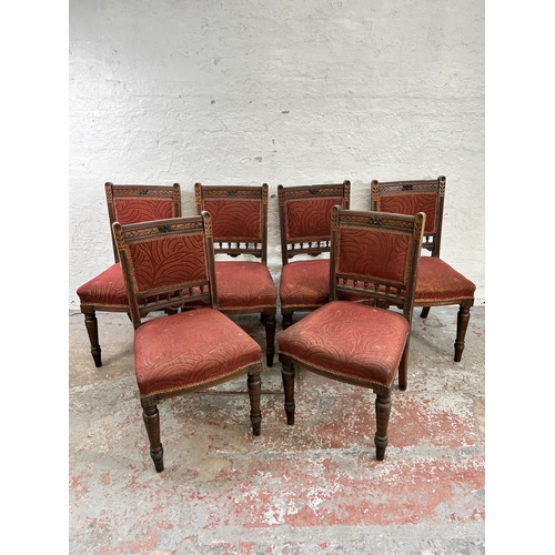 82 - Six Victorian carved oak and red fabric upholstered dining chairs stamped 'Tottie' to base