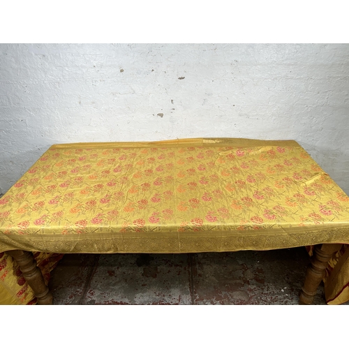 487 - A large Indian Silk floral patterned table runner - approx. 550cm x 110cm