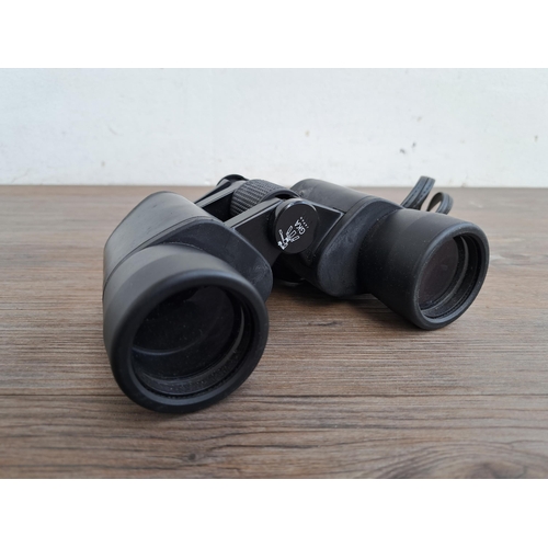 599 - A collection of binoculars to include RSPB 8 x 40 field 8.2, Prakpica Sport 12 x 25 RC etc.