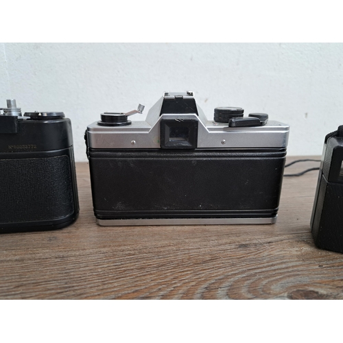 602 - A collection of cameras, lenses and cases to include Yashica J-P camera, Praktica MTL5B, one Zenit E... 