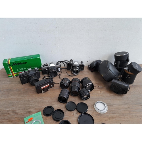 602 - A collection of cameras, lenses and cases to include Yashica J-P camera, Praktica MTL5B, one Zenit E... 