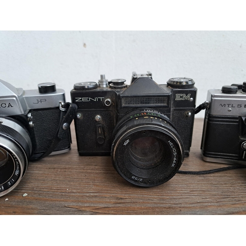 602 - A collection of cameras, lenses and cases to include Yashica J-P camera, Praktica MTL5B, one Zenit E... 