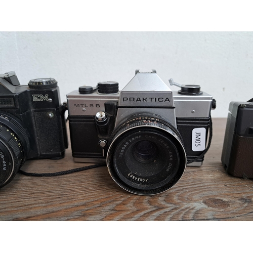 602 - A collection of cameras, lenses and cases to include Yashica J-P camera, Praktica MTL5B, one Zenit E... 