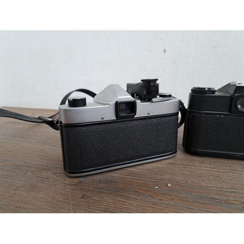 602 - A collection of cameras, lenses and cases to include Yashica J-P camera, Praktica MTL5B, one Zenit E... 