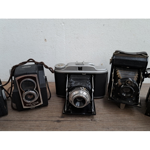 604 - A large collection of vintage cameras to include Vest Pocket Tenax, Polaroid Land Camera model 160, ... 