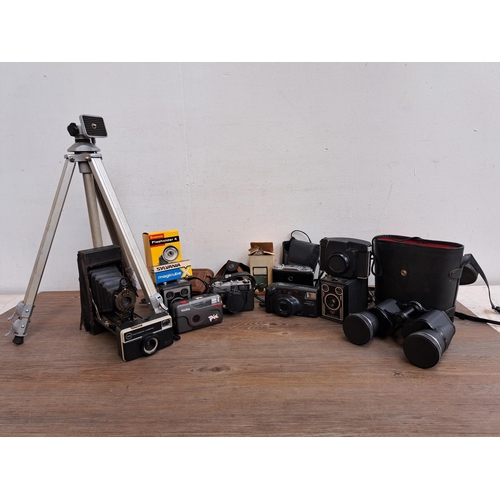 606 - A large collection of optical instruments and accessories to include Fujica MP camera, Yashica Zoomt... 