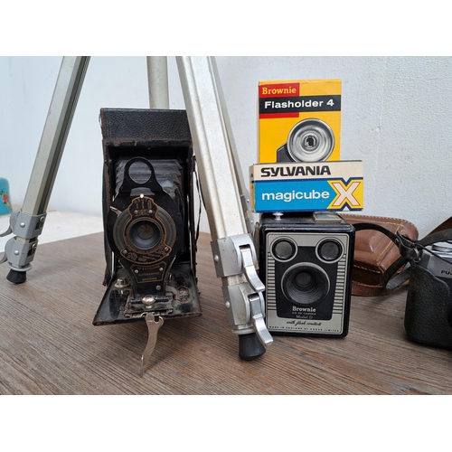 606 - A large collection of optical instruments and accessories to include Fujica MP camera, Yashica Zoomt... 