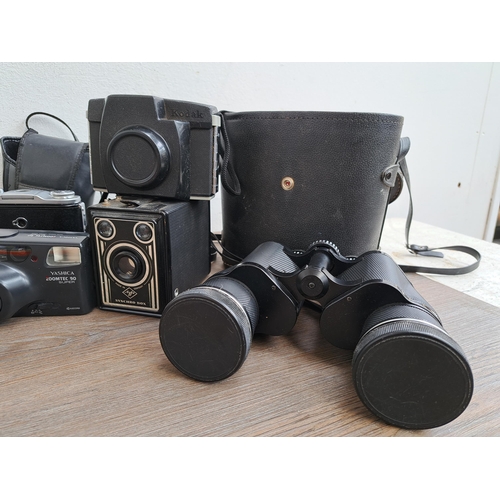 606 - A large collection of optical instruments and accessories to include Fujica MP camera, Yashica Zoomt... 