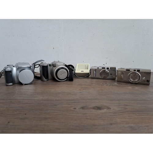 608 - A collection of Fujifilm cameras and accessories to include FinePix 4900 Zoom, FinePix F810 etc.