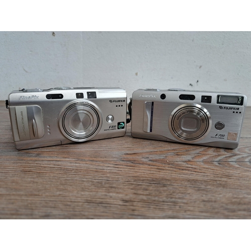 608 - A collection of Fujifilm cameras and accessories to include FinePix 4900 Zoom, FinePix F810 etc.