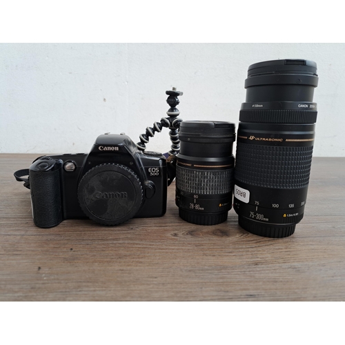 610 - Three Canon items, one EOS 500 SLR film camera, one Ultrasonic 20-80mm lens and one Ultrasonic 75-30... 