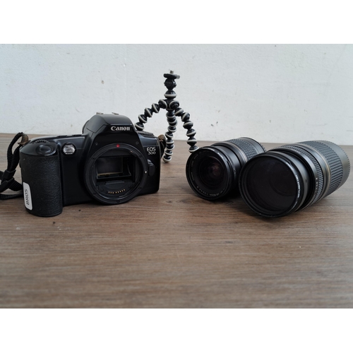 610 - Three Canon items, one EOS 500 SLR film camera, one Ultrasonic 20-80mm lens and one Ultrasonic 75-30... 