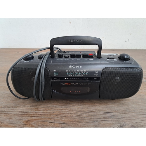 611 - Three items, one Goodmans MD105 CD Mini Hi-Fi system, one Sony CFS-E14L radio cassette-corder and on... 