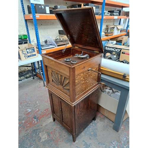 634 - A pine gramophone unit and cabinet containing various accessories and records