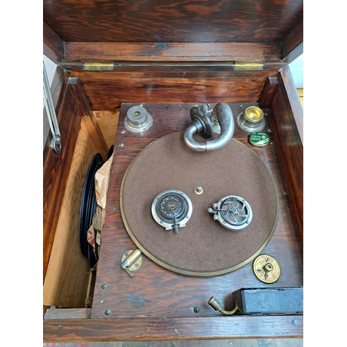 634 - A pine gramophone unit and cabinet containing various accessories and records