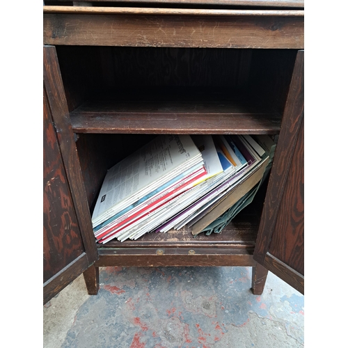 634 - A pine gramophone unit and cabinet containing various accessories and records