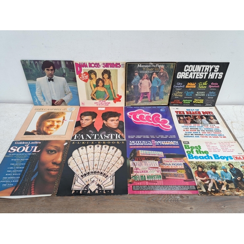 643 - A collection of vinyl records to include Elton John, Diana Ross, Cat Stevens and various compilation... 