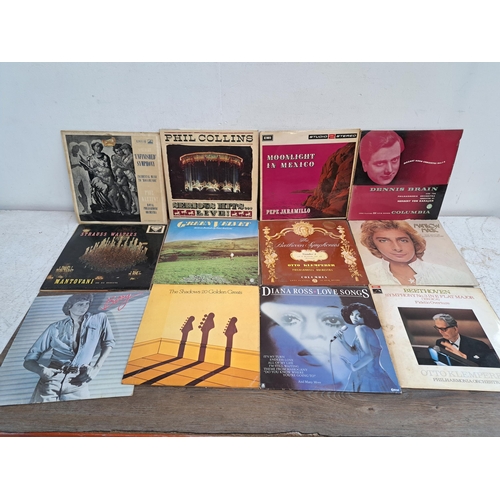 648 - A large collection of vinyl records to include The Shadows, Holst, Mozart etc.