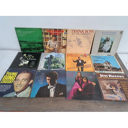 648 - A large collection of vinyl records to include The Shadows, Holst, Mozart etc.