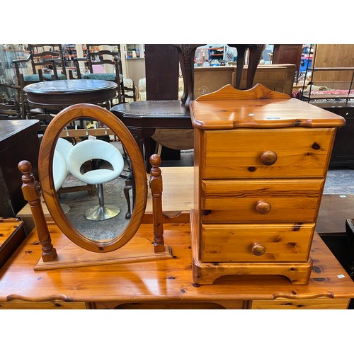 142 - Three pieces of pine bedroom furniture, dressing table, dressing table mirror and bedside chest of t... 