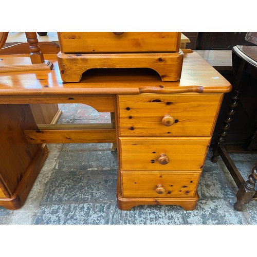 142 - Three pieces of pine bedroom furniture, dressing table, dressing table mirror and bedside chest of t... 