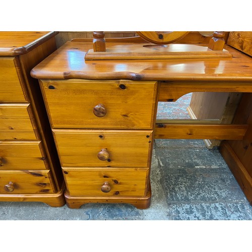 142 - Three pieces of pine bedroom furniture, dressing table, dressing table mirror and bedside chest of t... 