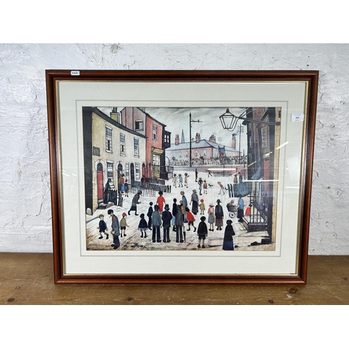 264 - A framed L. S. Lowry print - approx. 66cm high x 81cm wide