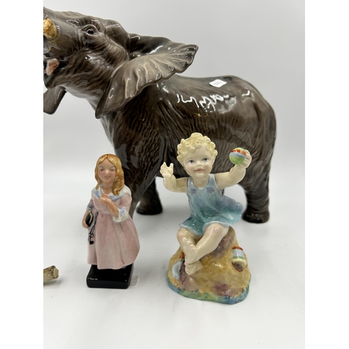 293 - Three ceramic figurines, Beswick elephant, Royal Worcester 3256 Sabbath Sunday Child and Royal Doult... 