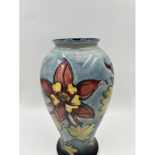 305 - A Moorcroft Columbine pattern vase - approx. 25cm high