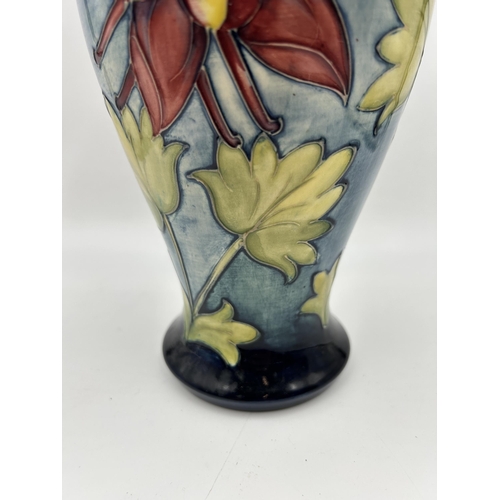 305 - A Moorcroft Columbine pattern vase - approx. 25cm high