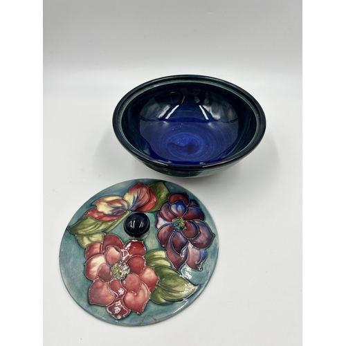 306 - A Moorcroft Clematis pattern circular lidded bowl - approx. 16cm diameter