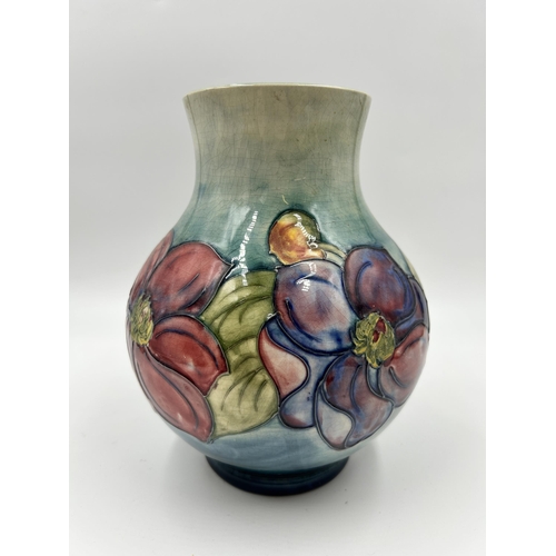 307 - A Moorcroft Clematis pattern vase - approx. 19cm high