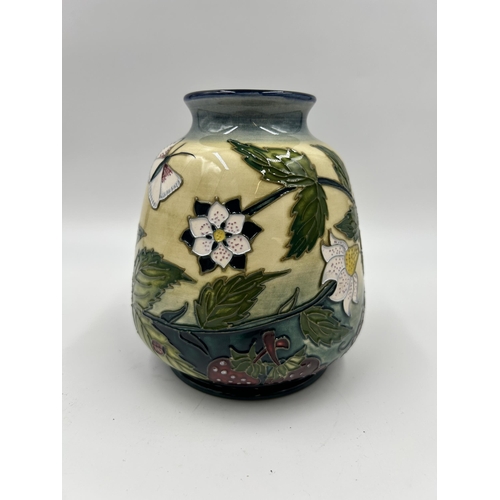 315 - A Moorcroft Fruit Garden pattern vase designed by Nicola Slaney - approx. 14cm high